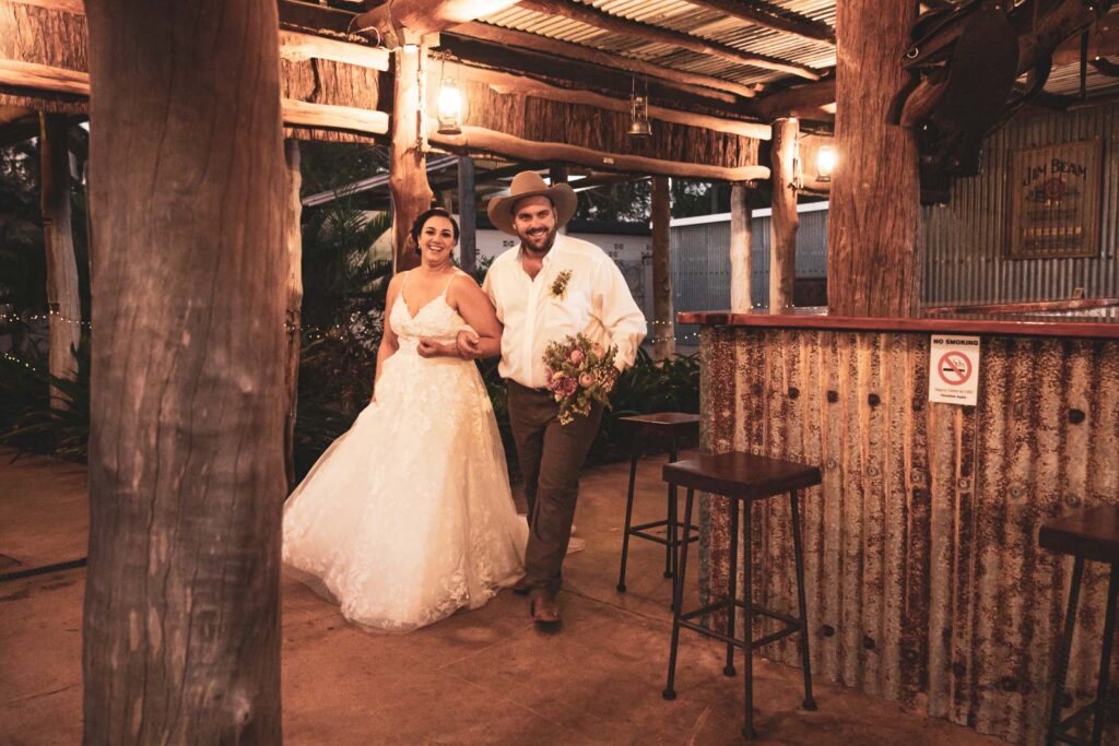 Bride and Groom make an entrance in rustic pub.