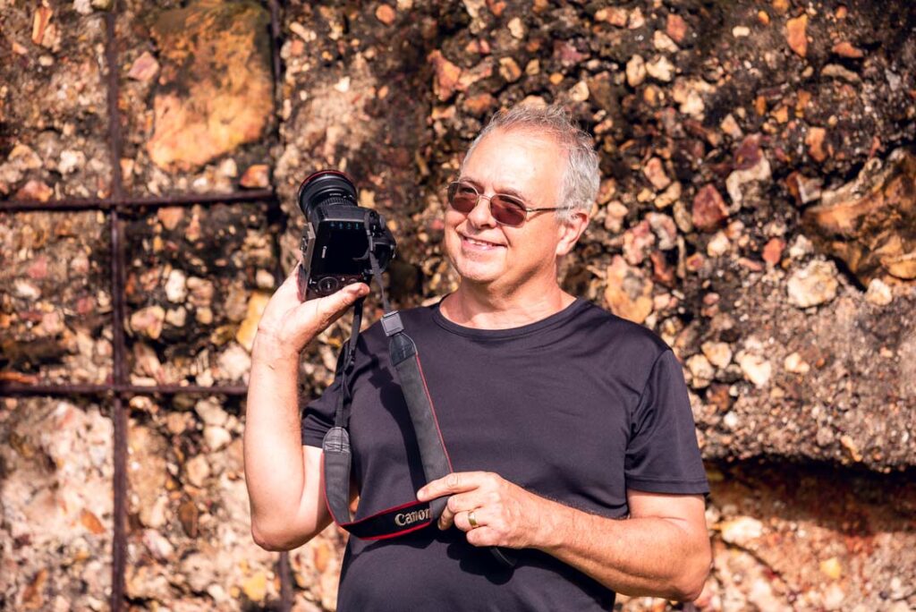 David Cook, Top End Photographer, holding a camera in fun pose