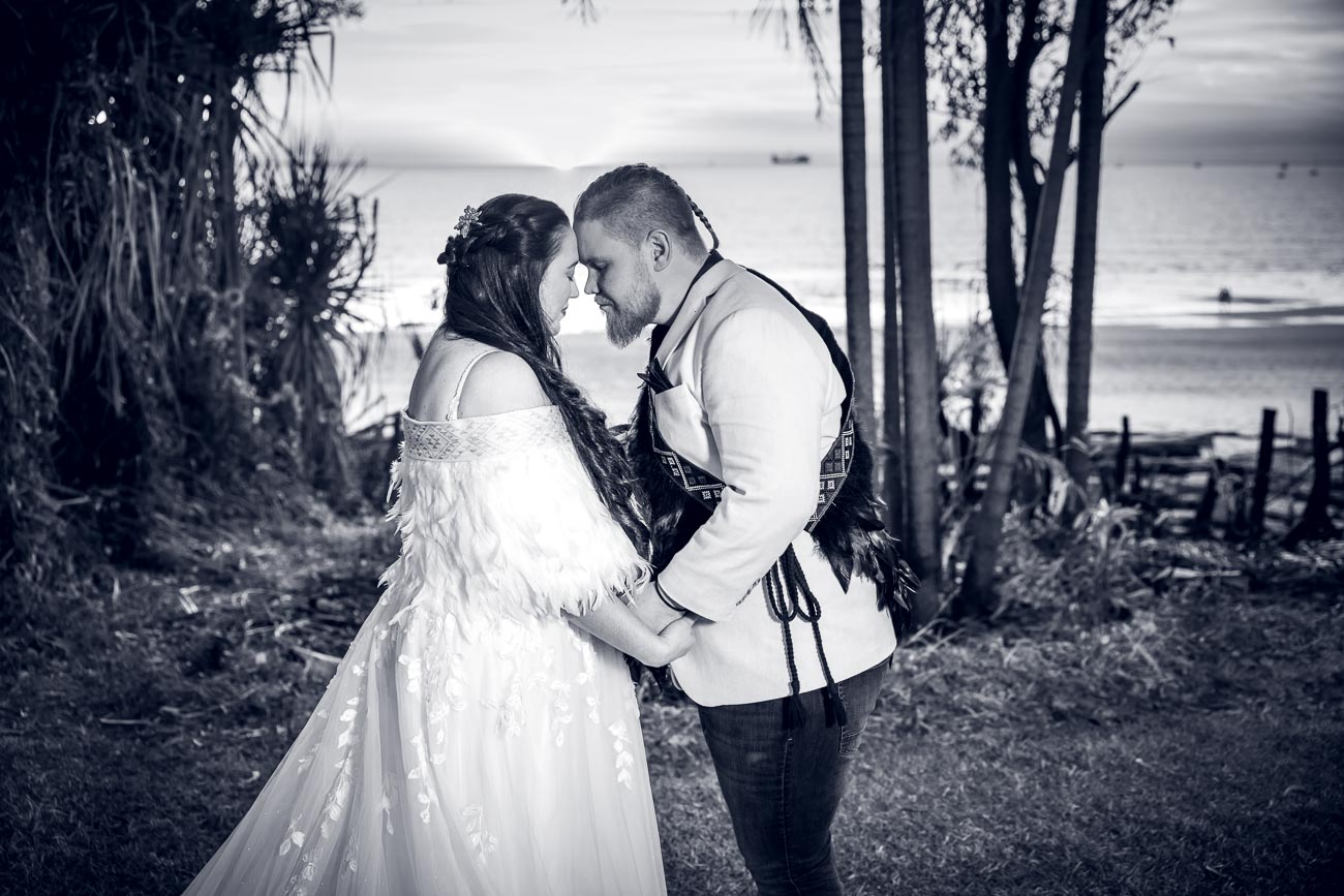 wedding couple embrace on Bundilla Beach